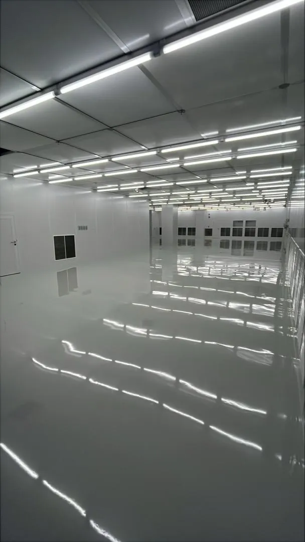 A completed cleanroom with sealed epoxy flooring and overhead lighting